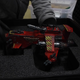 A rare, all-metal Space Marine Thunderhawk Gunship model is carefully placed in a custom foam case for transport by a pair of black-gloved hands.